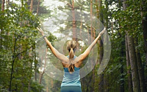 Healthy lifestyle fitness sporty woman early in forest area