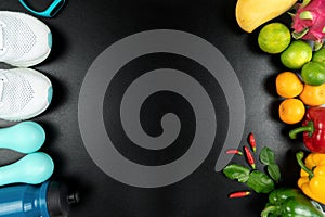 Healthy lifestyle, food and sport concept. athlete`s equipment and fresh fruit on black background