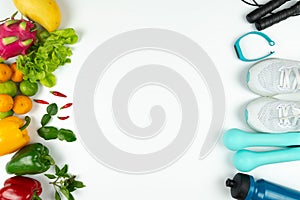 Healthy lifestyle, food and sport concept. athlete`s equipment and fresh fruit on white background