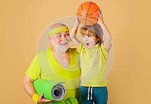Healthy lifestyle. Grandfather and Grandson sporting. Basketball. Sport for kids. Happy family.