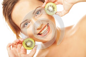 Healthy lifestyle - happy woman holding kiwi isolated on white