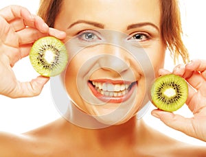 Healthy lifestyle - happy young woman holding kiwi