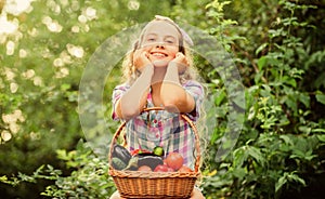 Healthy lifestyle. Kid hold basket with vegetables nature background. Eco farming. Eat healthy. Summer harvest concept