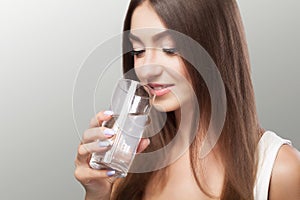 Healthy Lifestyle. Portrait Of Happy Smiling Young Woman With Glass Of Fresh Water. Healthcare. Drinks. Health, Beauty, Diet