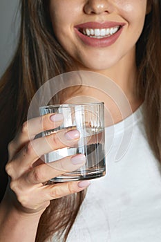 Healthy Lifestyle. Portrait Of Happy Smiling Young Woman With Glass Of Fresh Water. Healthcare. Drinks. Health, Beauty