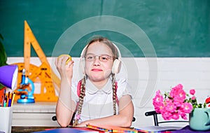 Healthy lifestyle. School life concept. Modern childhood. School break. Schoolgirl sit desk chalkboard background. Kid