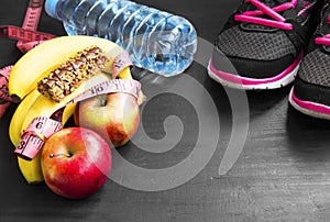 Healthy lifestyle with sport items , fruits and water