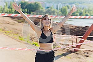 Healthy lifestyle sports woman running on asphalt driveway.