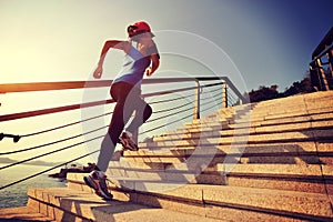 Healthy lifestyle sports woman running up on stone stairs
