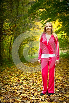 Healthy lifestyle. Sporty active blonde girl outdoor in park