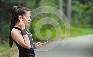 healthy lifestyle sporty woman with headphone jogging in beautiful nature area