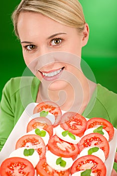 Healthy lifestyle - woman with caprese salad