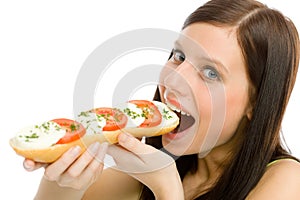 Healthy lifestyle - woman eat caprese sandwich