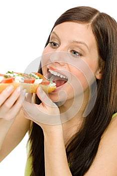 Healthy lifestyle - woman eat caprese sandwich