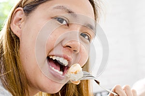 Healthy lifestyle woman eating shrimp smiling happy on beautifu