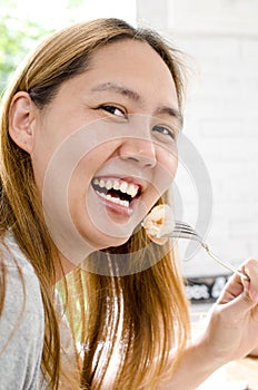 Healthy lifestyle woman eating shrimp smiling happy on beautifu