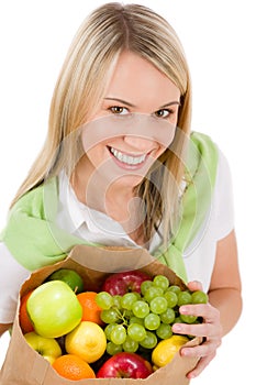 Healthy lifestyle - woman with fruit in bag