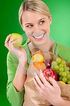 Healthy lifestyle - woman with fruit in paper bag