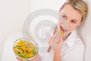 Healthy lifestyle - woman holding fruit salad