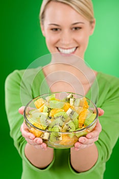 Healthy lifestyle - woman holding fruit salad bowl