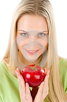 Healthy lifestyle - woman holding red apple