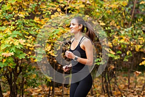 Healthy lifestyle. Woman jogging on forest trail