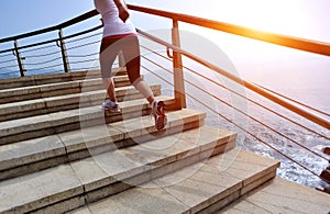 Healthy lifestyle woman legs running on stone stai