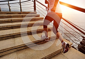 Healthy lifestyle woman legs running on stone stai