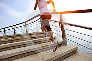 Healthy lifestyle woman legs running on stone stai