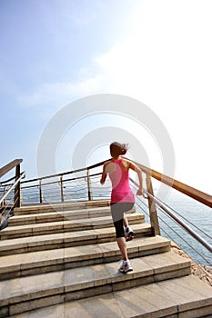 Healthy lifestyle woman legs running on stone stai