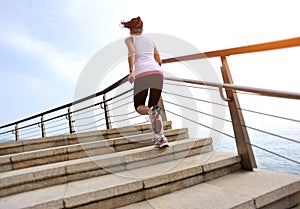 Healthy lifestyle woman legs running on stone stai