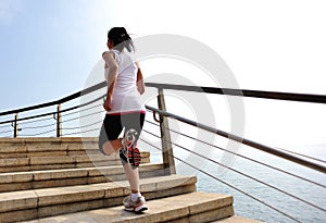 Healthy lifestyle woman legs running on stone stai