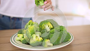 Healthy lifestyle woman preparing green juice.