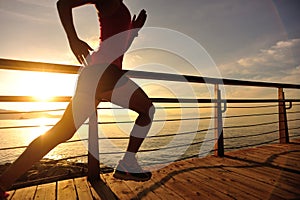 Healthy lifestyle woman runner running seaside