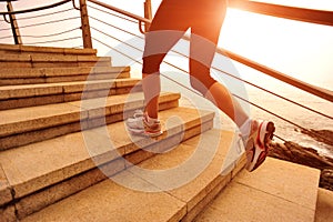 Healthy lifestyle woman running on stone stairs