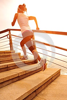 Healthy lifestyle woman running on stone stairs