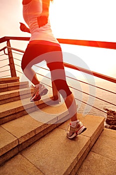 Healthy lifestyle woman running on stone stairs