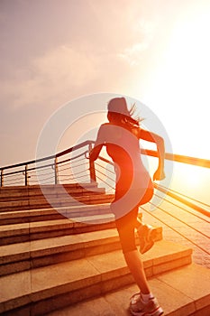 Healthy lifestyle woman running on stone stairs