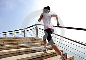 Healthy lifestyle woman running on stone stairs