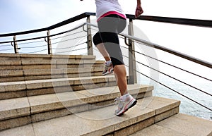 Healthy lifestyle woman running on stone stairs