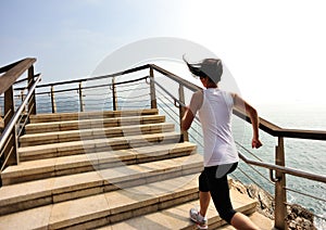 Healthy lifestyle woman running on stone stairs