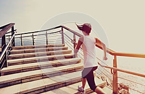 Healthy lifestyle woman running on stone stairs