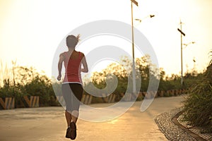 Healthy lifestyle woman running sunrise