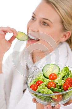 Healthy lifestyle - woman with vegetable salad