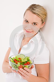 Healthy lifestyle - woman with vegetable salad