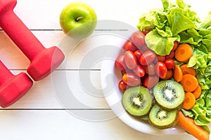 Healthy lifestyle for women diet with sport equipment, vegetable and fruits fresh, green apples on wooden.