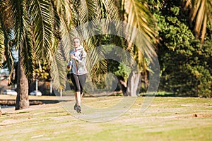 Healthy lifestyle young sporty woman jogging at