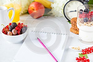 Healthy light breakfast: parfait with muesli, berries and yogurt