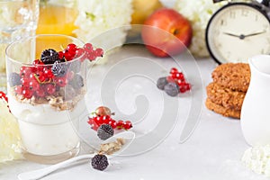 Healthy light breakfast: parfait with muesli, berries and yogurt