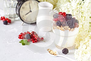 Healthy light breakfast: parfait with muesli, berries and yogurt